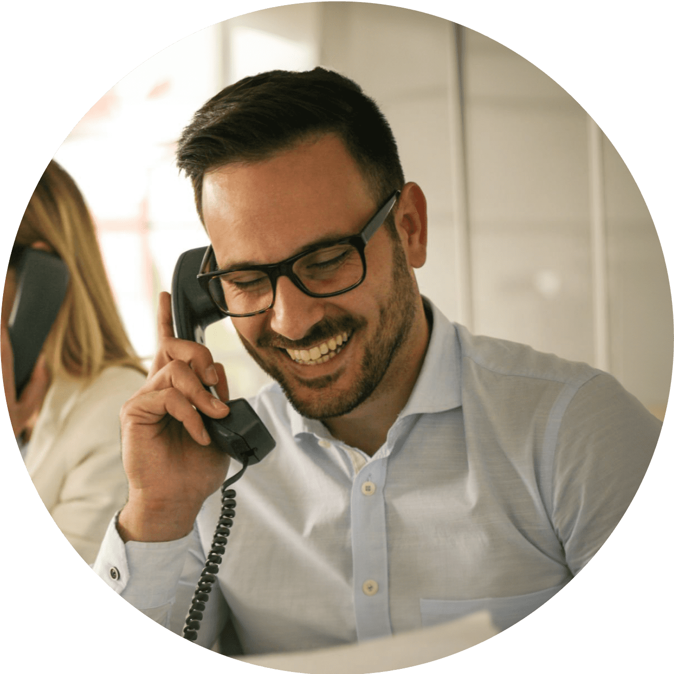 Smiling man on phone call in office